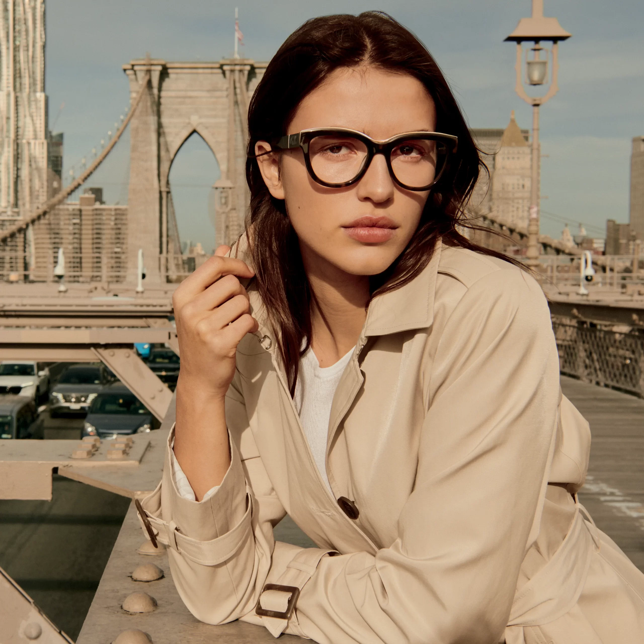 A model wearing DKNY glasses.