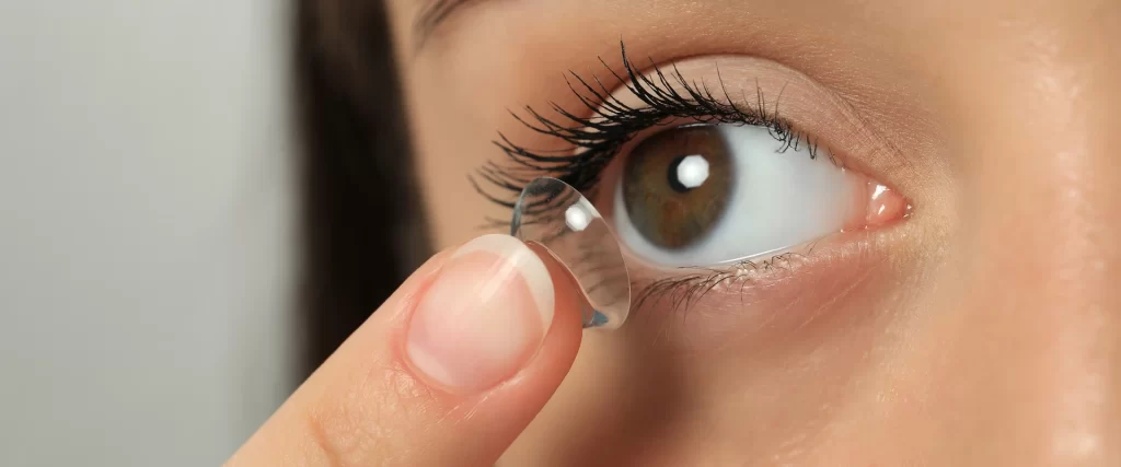 Putting on contact lenses