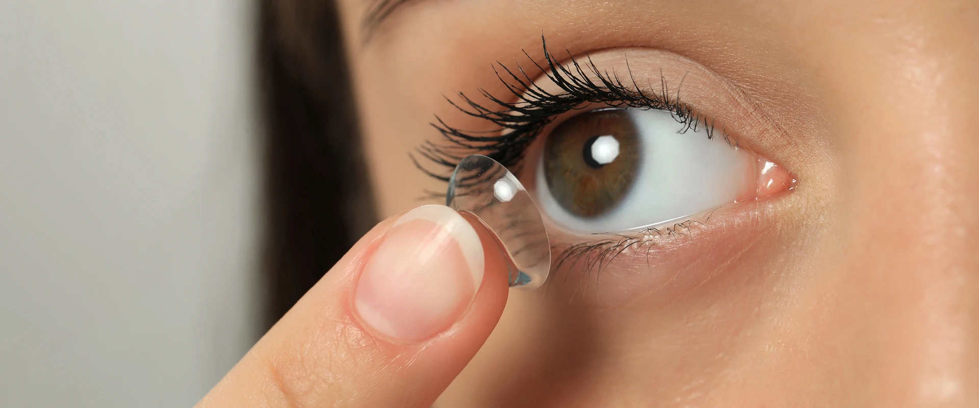 Putting on contact lenses