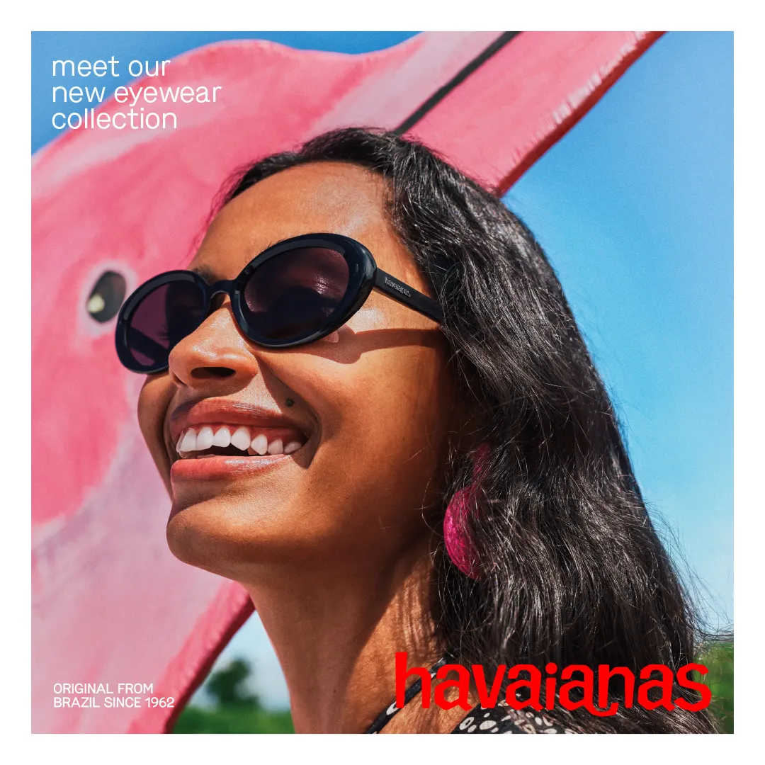 smiling woman wearing havaianas sunglasses